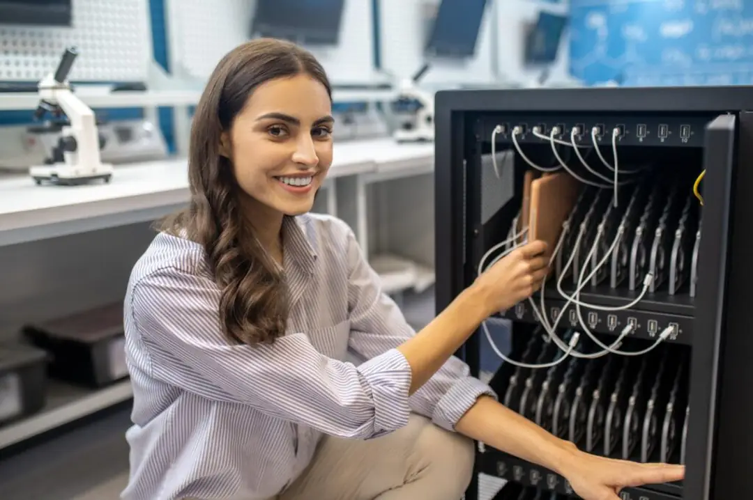 Technician assembling an R.F. Mote cabinet in a lab